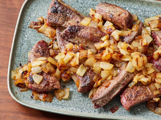 Pan fried beef liver topped with caramelized onions