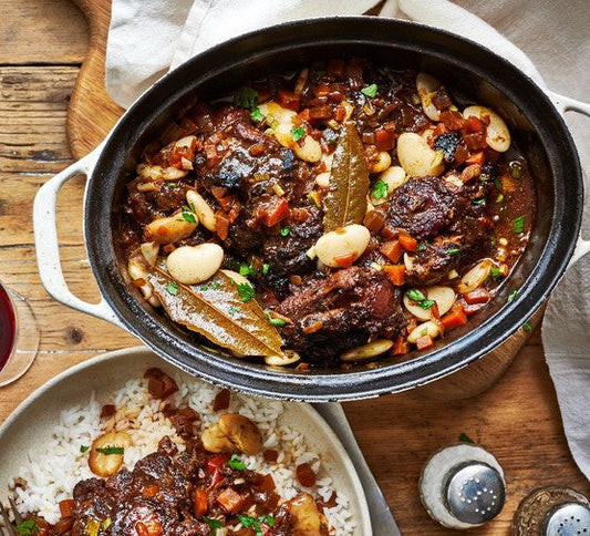 Tender Jamaican oxtail stew with butter beans in a rich savory broth.