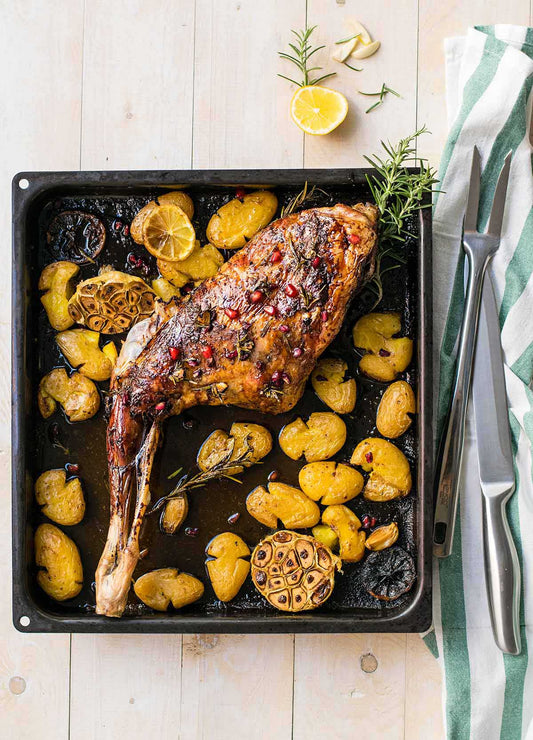 Leg of Goat with rosemary and garlic served with roasted potatoes