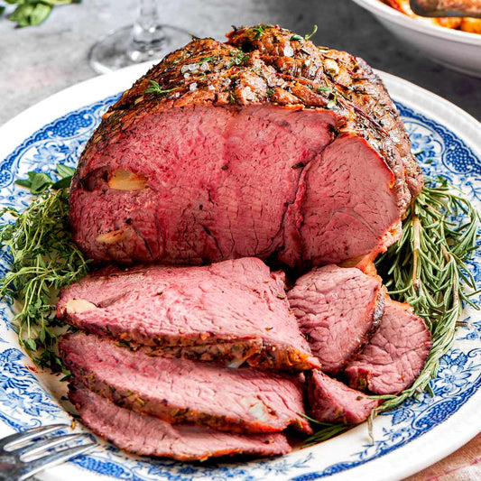 Slow cooked rump roast with vegetables, showcasing tender, juicy beef.